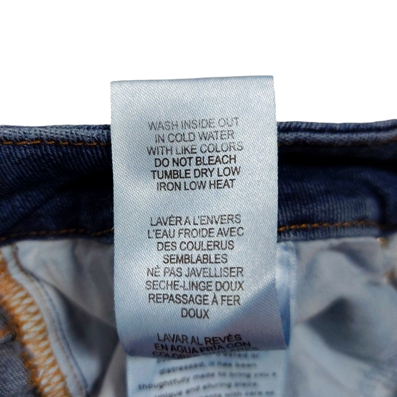 Good American Busted Knee Raw Hem Stretch Jeans - Picture 10 of 12